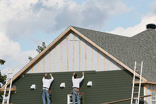 Professional Siding technician working in Kent, OH